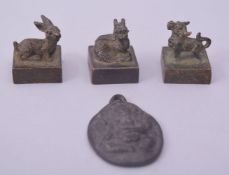 THREE CHINESE BRONZE SEALS, together with an Indian bronze pendant (4).