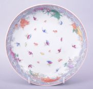 A CHINESE PORCELAIN DRAGON AND BAT DISH, painted with numerous bats amongst stylised clouds and