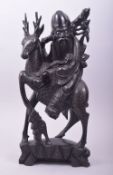 A CHINESE CARVED HARDWOOD AND METAL WIRE INLAID FIGURE of Shoulao and deer, the figure with inset