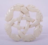 A CHINESE CARVED AND PIERCED JADE PENDANT, 5cm diameter.