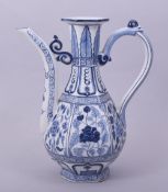 A CHINESE BLUE AND WHITE PORCELAIN EWER, painted with foliate decoration, 23.5cm high.