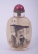 A CHINESE REVERSE GLASS PAINTED SNUFF BOTTLE AND STOPPER, 9cm high.