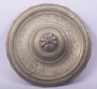 AN ISLAMIC ENGARVED CALLIGRAPHIC BRASS CIRCULAR BASE, 26cm diameter.