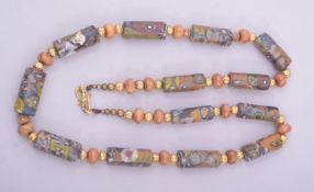 A MIDDLE EASTERN BEADED NECKLACE.