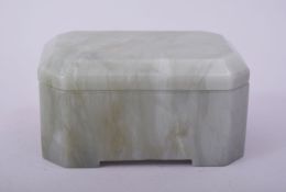 AN INDIAN GREEN VARIEGATED HARDSTONE RECTANGULAR BOX AND COVER, with clipped edges, 11cm x 7cm.