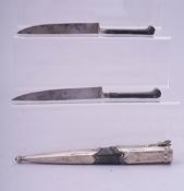 A RARE 18TH CENTURY OTTOMAN SILVER MOUNTED TROUSE, the two knives with black coral handles and