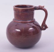 A CHINESE OX BLOOD GLAZE PORCELAIN JUG, with incised decoration under glaze depicting dragon and