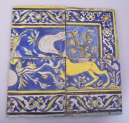 FOUR PERSIAN SAFAVID CUERDA SECA POTTERY TILES, decorated with floral part borders and sections of a