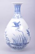 A CHINESE MING STYLE BLUE AND WHITE YUHUCHUNPIN VASE, decorated with birds and native flora, 32cm