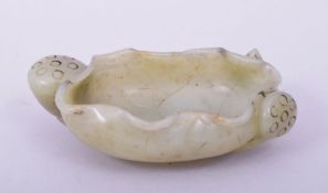 A GOOD 19TH CENTURY CHINESE CARVED JADE BRUSH WASHER, in form of a lily and lotus root, 9cm wide.