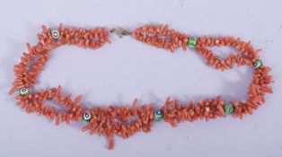 A NATURALISTIC CORAL NECKLACE, including seven small millefleur beads.