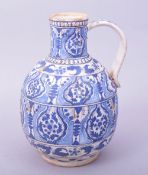A RARE TURKISH OTTOMAN KUTAHYA POTTERY WATER JUG, decorated in blue and white with floral motifs,