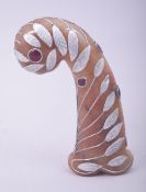 AN INDIAN HARDSTONE WHITE METAL OVERLAID MUGHAL STYLE DAGGER HILT, inset with semi precious