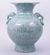 A CHINESE ROBINS EGG GLAZED TWIN HANDLE VASE, the base with six character mark, 25.5cm high.