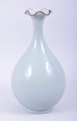 A CHINESE CELADON GLAZE BOTTLE VASE, with foliate form rim, 30cm high.