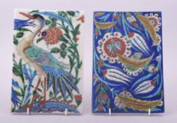 TWO TURKISH IZNIK TILES, one painted with a bird, the other with floral sprays, each approx. 23.