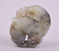 A CHINESE CARVED JADE PENDANT, 5.5cm.