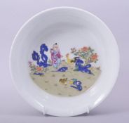 A CHINESE FAMILLE JAUNE PORCELAIN BOWL, the interior decorated with a figure and cockerel, the