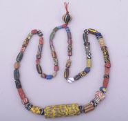 A MIXED MIDDLE EASTERN BEADED NECKLACE.