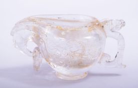 A CHINESE CUT GLASS LIBATION CUP, with handle and spout, 12.5cm long.