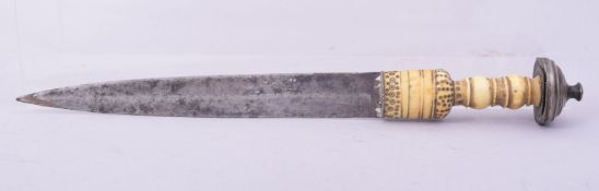 AN EARLY ISLAMIC OR AFRICAN IVORY HILTED DAGGER, 29.5cm long