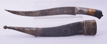 A LARGE INDO PERSIAN ENGRAVED DAGGER AND SCABBARD, 48cm long overall.