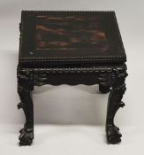 A SMALL CHINESE SQUARE FORM HARDWOOD TABLE, with carved floral frieze, supported on four curving