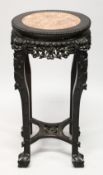 A CHINESE CARVED HARDWOOD AND MARBLE INSET VASE STAND, with pierced and carved frieze depicting