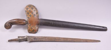 A SOUTH EAST ASIAN KRIS DAGGER, 43cm long, together with a similar blade, 36cm long (2).