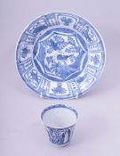A CHINESE BLUE AND WHITE PORCELAIN DISH, 21cm diameter, together with a blue and white tea cup, (