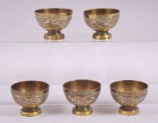 FIVE 19TH CENTURY SYRIAN SILVER AND COPPER OVERLAID PEDESTAL CUPS, diameter 5.5cm.