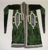 AN UZBEKISTAN EMERALD GREEN VELVET COAT, with embroidered decoration.