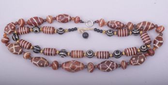TWO AGATE BEADED NECKLACES.
