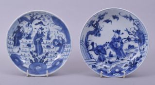 A NEAR PAIR OF CHINESE BLUE AND WHITE PORCELAIN DISHES, both depicting figures in an outdoor