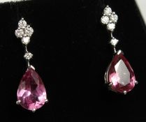 A GOLD PAIR OF PEAR-SHAPED SAPPHIRE AND DIAMOND DROP EARRINGS.