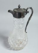 A CUT GLASS CLARET JUG with SILVER-PLATED mounts. 11.5ins high.