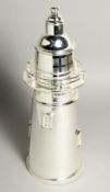 A SILVER-PLATED LIGHTHOUSE COCKTAIL SHAKER 14ins high.