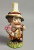 A 19TH CENTURY DERBY FIGURE OF A MANSION HOUSE DWARF standing holding a cane, his hat being an