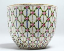 A GOOD LARGE SEVRES PORCELAIN BOWL OR JARDINIERE, painted with a trellis design with pink roses.