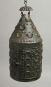 A PUNCHWORK TIN CIRCULAR LANTERN. 8.5ins high.