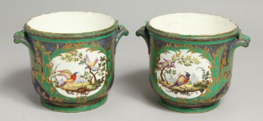 A GOOD PAIR OF 19TH CENTURY SEVRES PORCELAIN POTS dark blue ground edged in gilt and painted with