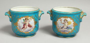 A GOOD PAIR OF 19TH CENTURY SEVRES PORCELAIN POTS, pale blue ground, edged in gilt and painted