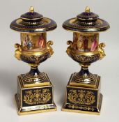 A SUPERB PAIR OF 19TH CENTURY VIENNA URN SHAPED VASES, COVERS AND BASES, rich blue ground with