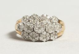 A GOOD GOLD AND DIAMOND CLUSTER RING