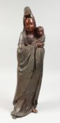 A LARGE BRONZE OF A LADY HOLDING A BABY. 23ins high.