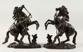 A VERY GOOD PAIR OF 19T CENTURY BRONZE MARLEY HORSES AND ATTENDANTS. 11ins high.