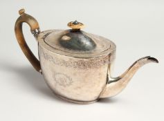 A GEORGE III OVAL TEA POT AND COVER with engraved decoration and initials M C. London 1800, maker
