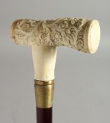 A WALKING STICK with carved bone handle 'Acanthus'. 35ins long.