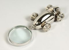 A MOULDED CHROME RACING CAR MAGNIFYING GLASS.