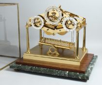 ANDREW FELL. A SUPERB LIMITED EDITION LACQUERED BRASS ARCHITECTURAL DESIGN ROLLING BALL CLOCK,